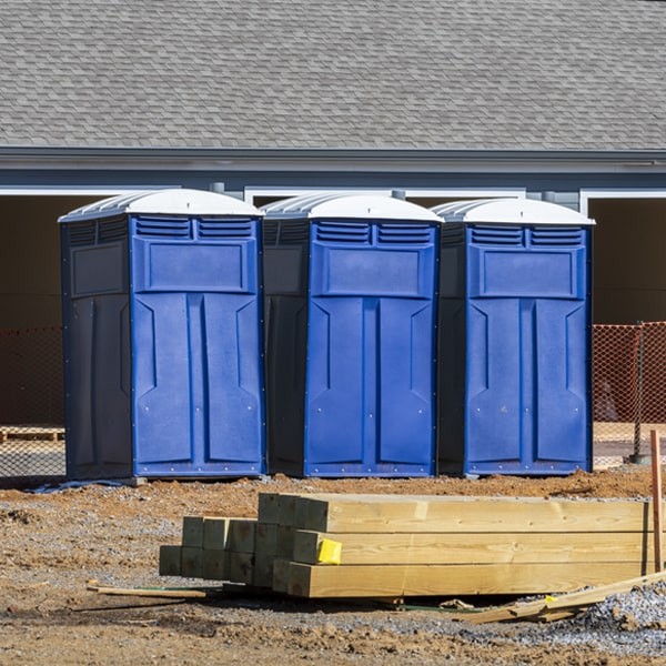 what is the cost difference between standard and deluxe portable toilet rentals in Currituck